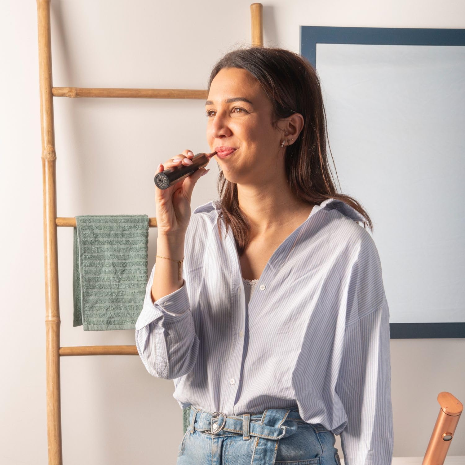 view of person brushing teeth with a Y-Brush Clean Mate electric toothbrush