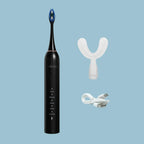 view of a Y-Brush DuoBrush electric sonic toothbrush on a blue background