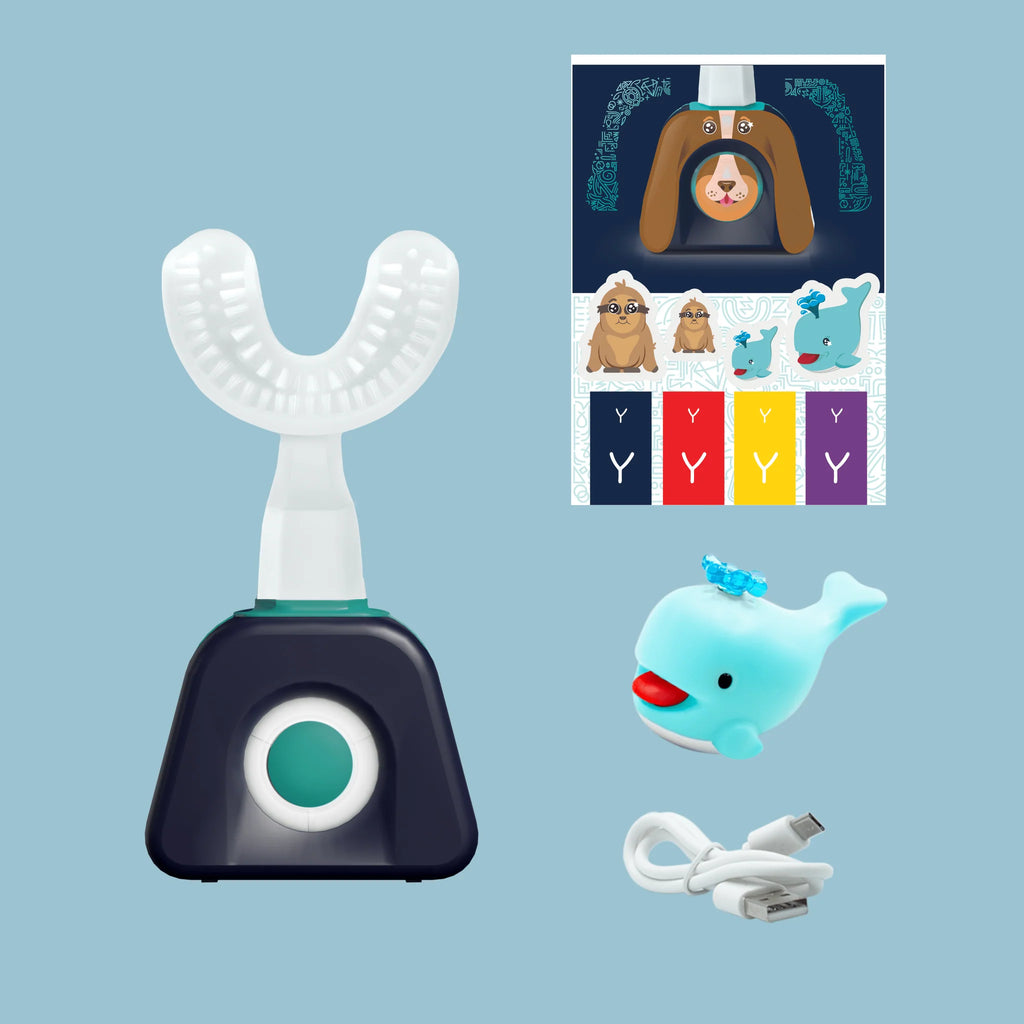 White and black dental device with cartoon characters and whale toy on a blue background